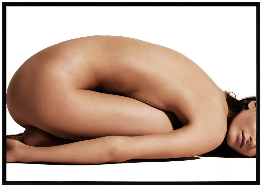 Poster of naked woman with belly lying against thighs. Black frame. 
