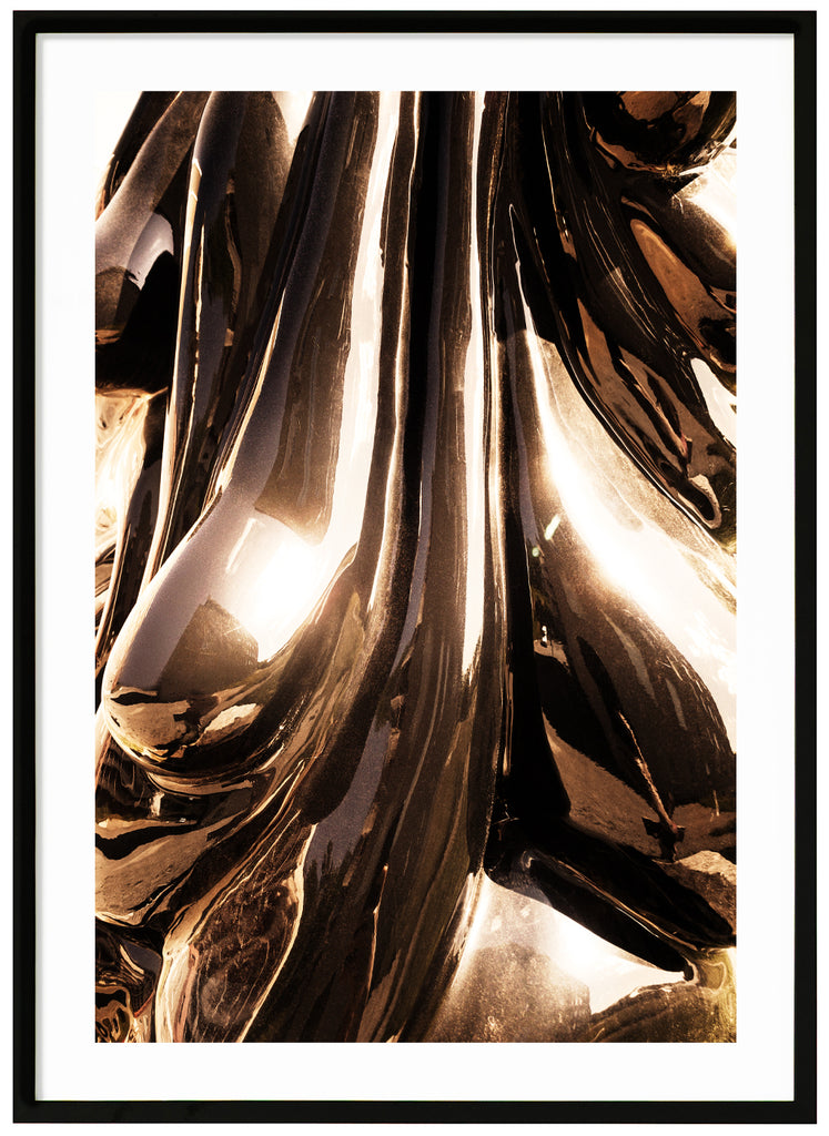 Abstract motif of metallic surface that goes in bronze-like tones. Black frame.