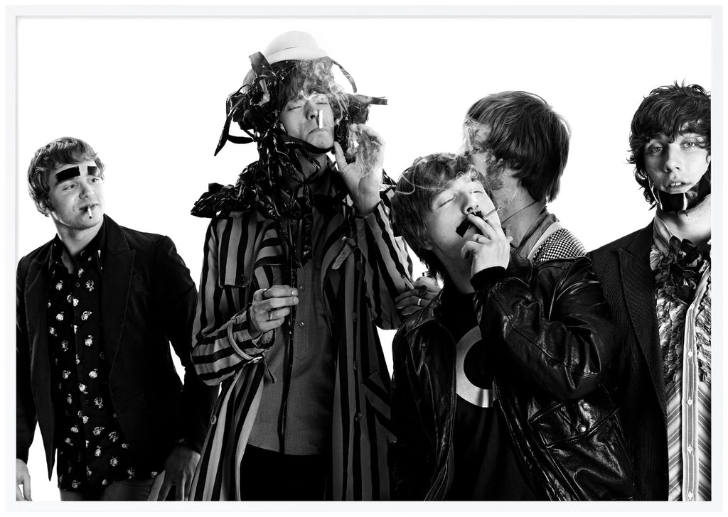 Black-and-white photograph of the rock band Mando Diao taken by Patrik Sehlstedt. White frame. 