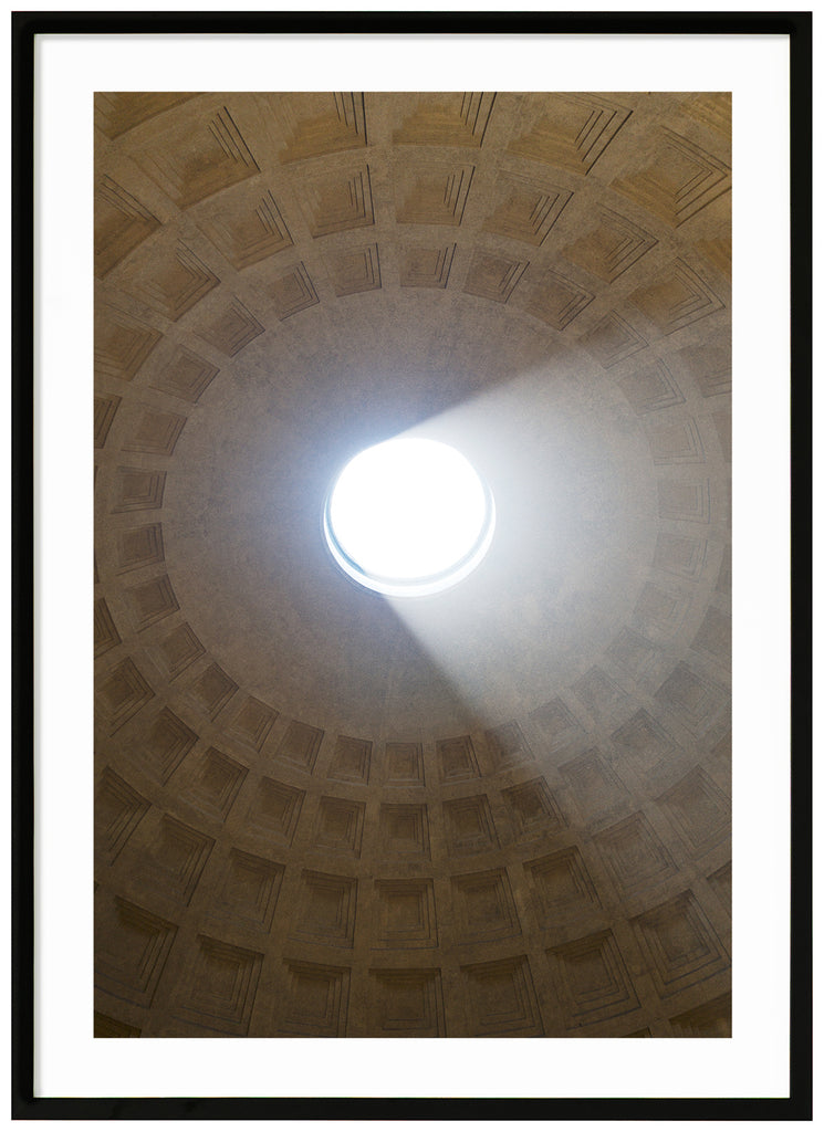The oculus in the dome inside the Pantheon in Rome. The building was built in the years 115-125. Black frame.