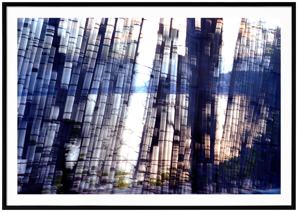 Color photography of abstract motifs in blue tones.  Black frame. 