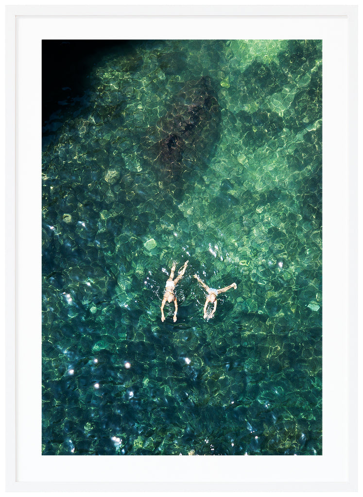 Records of two people swimming. Portrait format. White frame. 