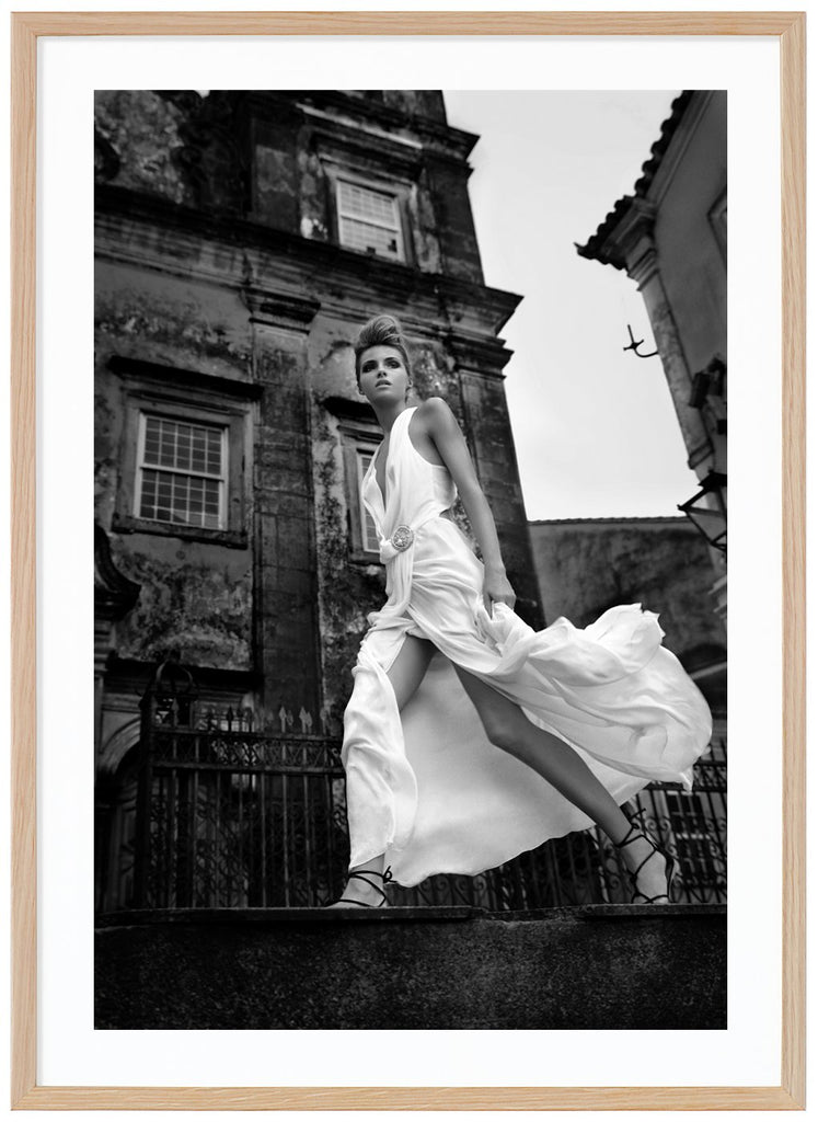 Black and white fashion photography of a woman in white dress. Oak frame. 