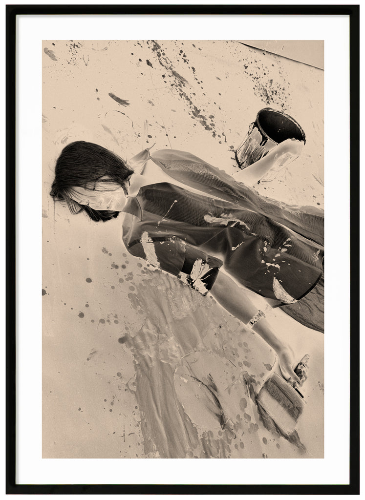 Monochrome photograph of a woman. Black frame. 