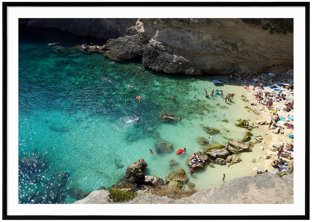 Posts of bathing place with people between rocks. Swimming people and floating mattresses. Black frame. 