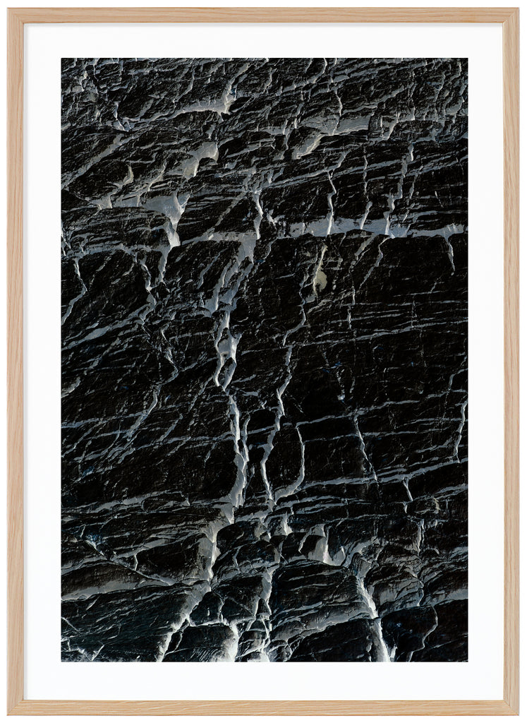 Black and white semi abstract poster with cracks. Oak frame. 
