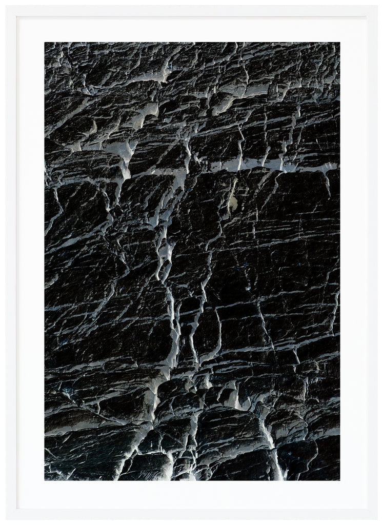 Black and white semi abstract poster with cracks. White frame. 