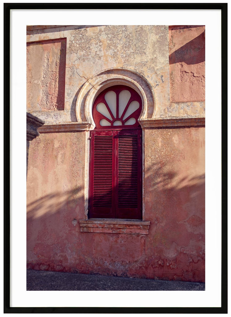Poster of a window with red shutters. Black frame. 