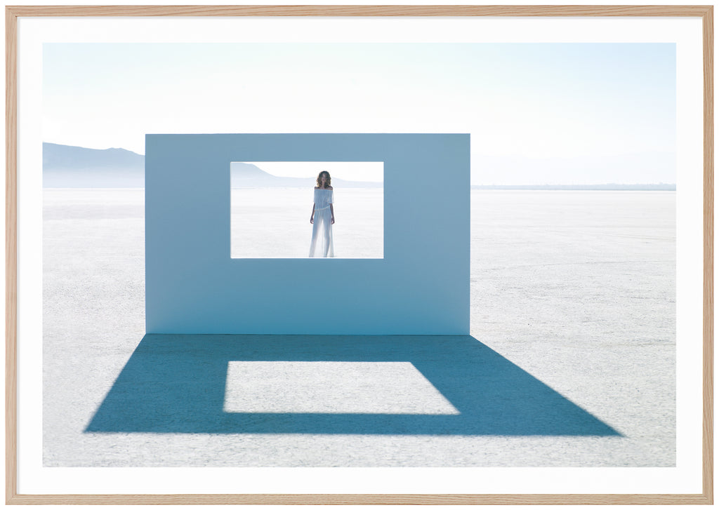 Poster of a woman standing behind a wall. Oak frame. 