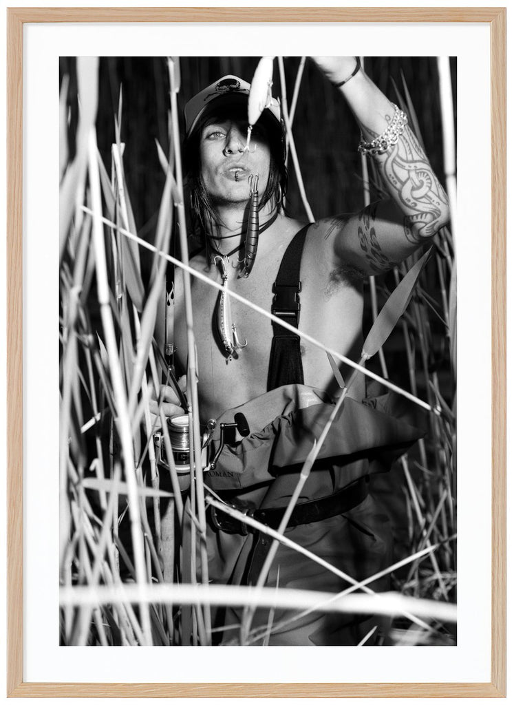 Black and white poster by Andreas Tyrone Dregen fishing among reeds. Oak frame. 