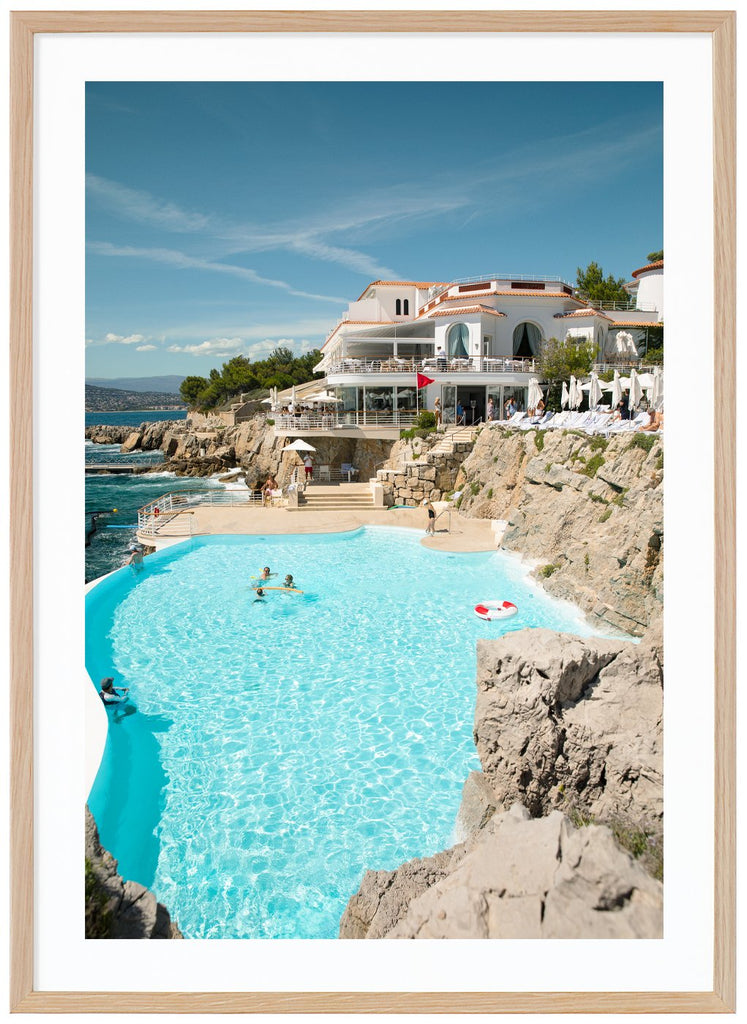 Eden Roc posters in color with the pool in the foreground. Oak frame.