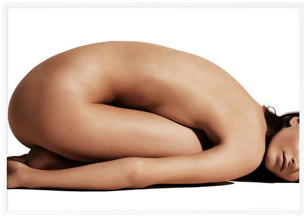Poster of naked woman with belly lying against thighs. White frame. 