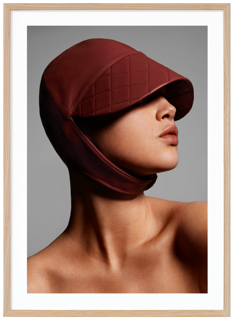 Poster of close-up of woman with leather hat. Oak frame. 