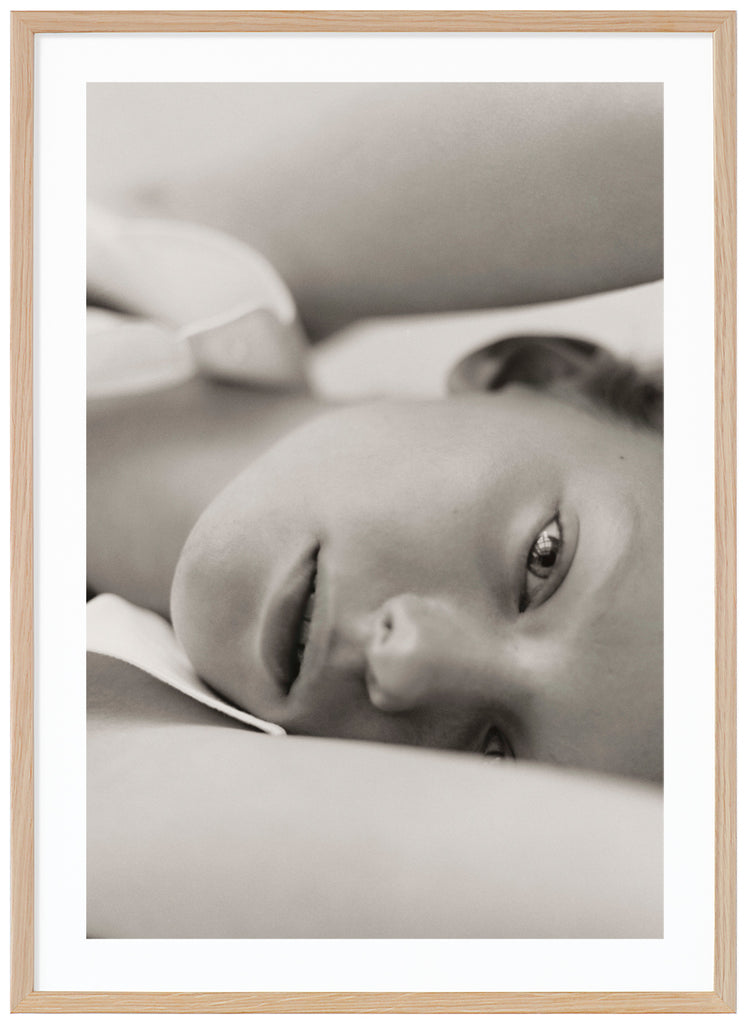 Black and white poster of close-up of woman. Standing. Oak frame. 