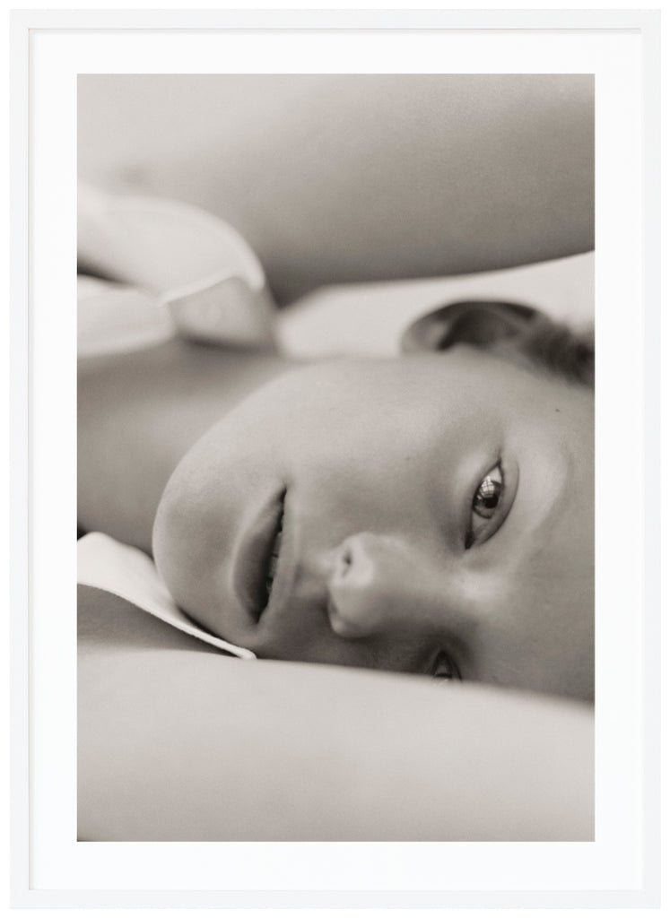 Black and white poster of close-up of woman. Standing. White frame.