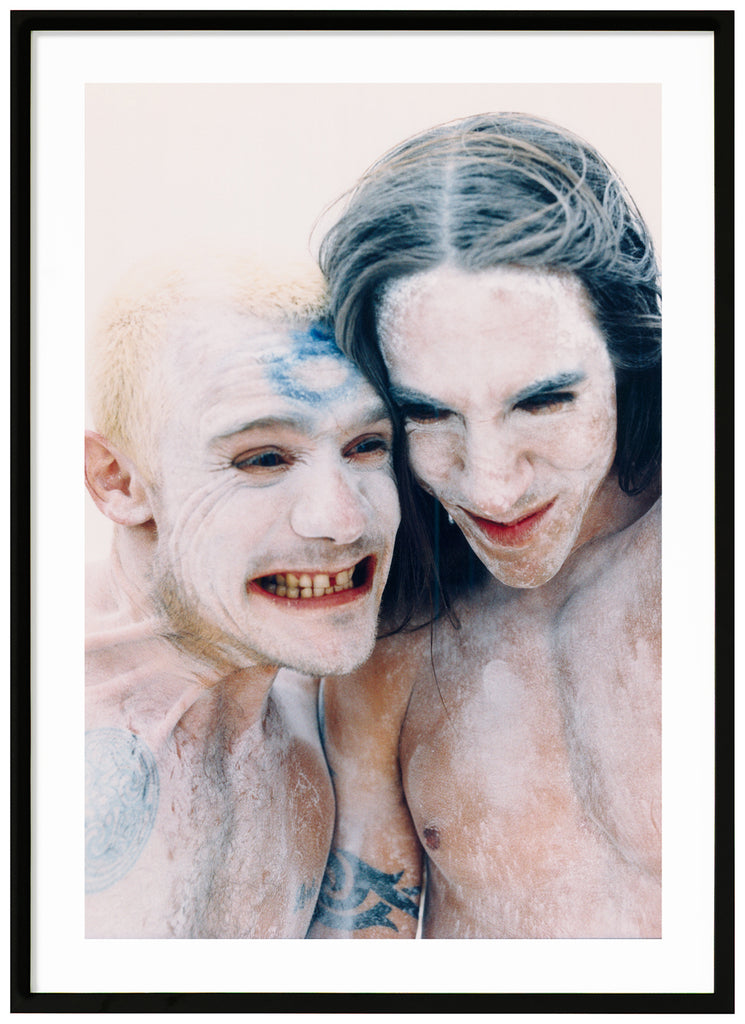 Flea and Anthony Kiedis from the Red Hot Chili Peppers portrayed. Black frame.