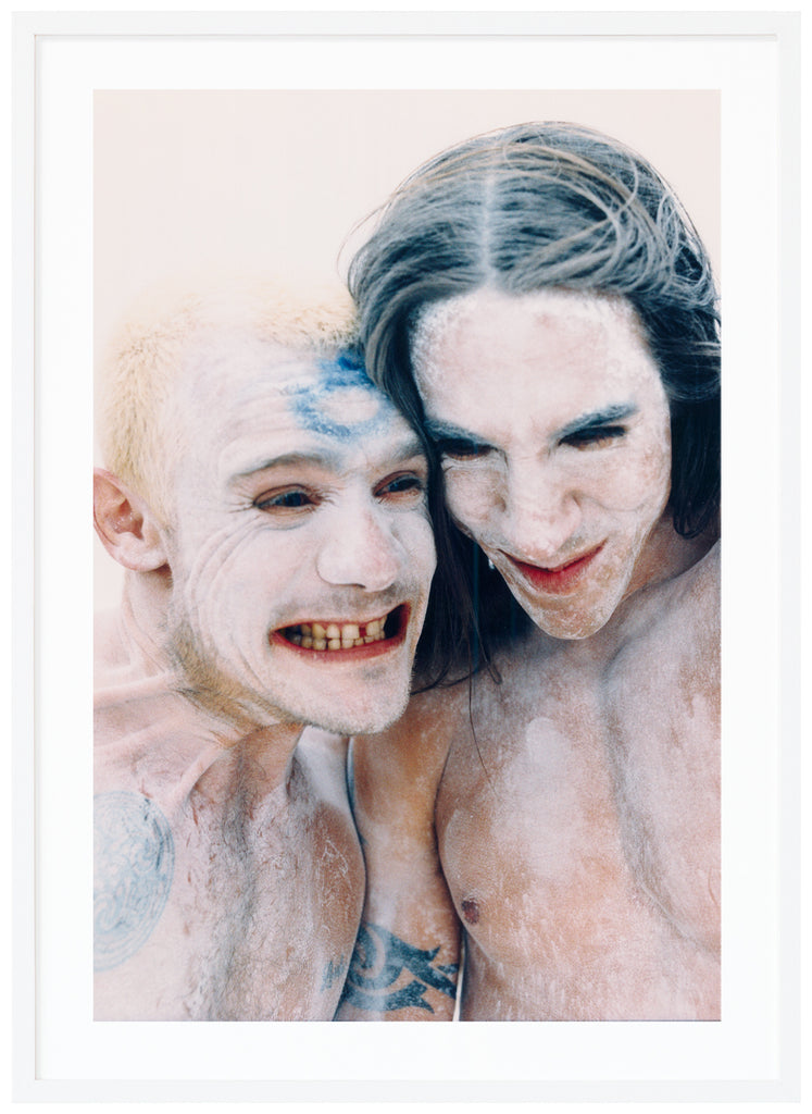 Flea and Anthony Kiedis from the Red Hot Chili Peppers portrayed. White frame. 