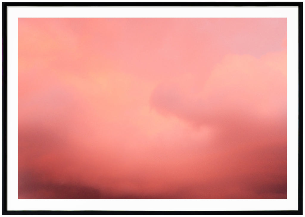 Poster of pink clouds in horizontal format. Black frame. 