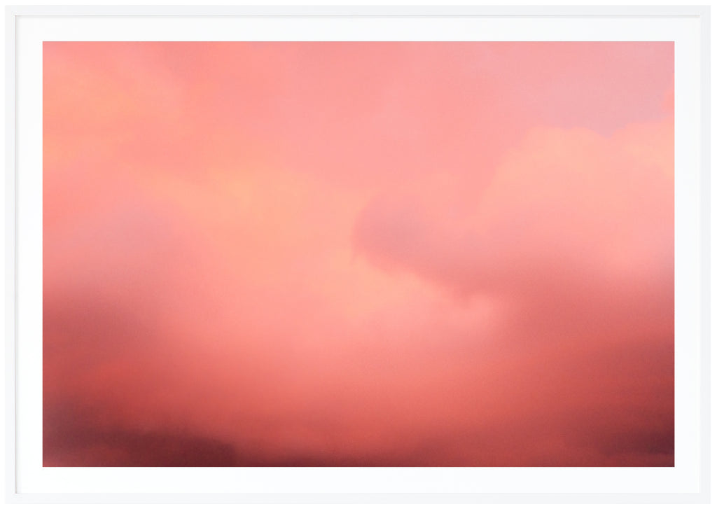 Poster of pink clouds in horizontal format.  White frame.