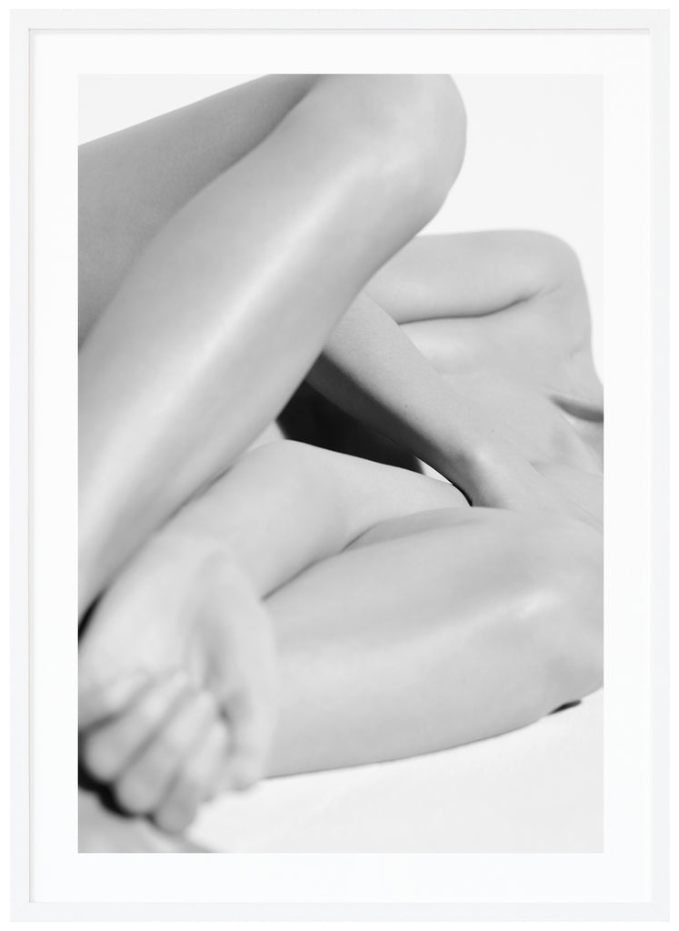 Black & white photo art of a nude body. White frame. 