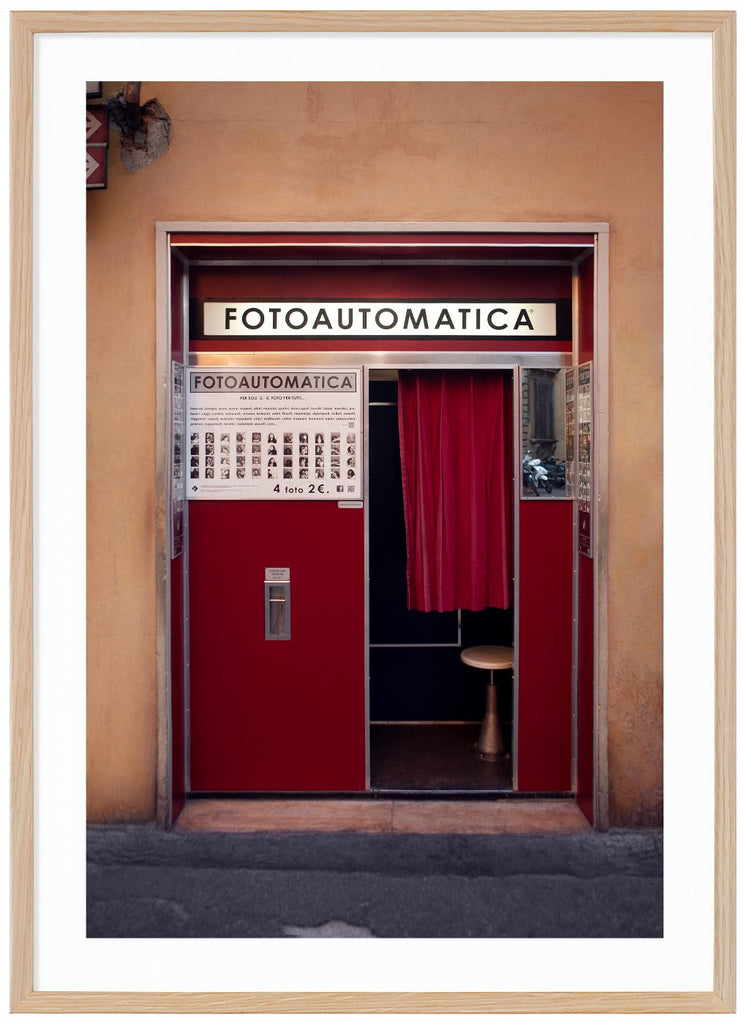 Photography of an old photo booth located in a wall in an Italian city. Oak frame. 