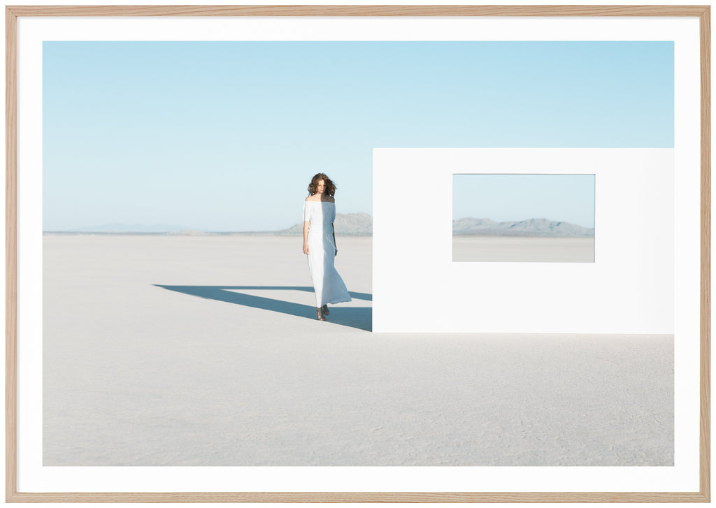 Photography of a woman in white dress in the Mojave Desert, California. Oak frame. 
