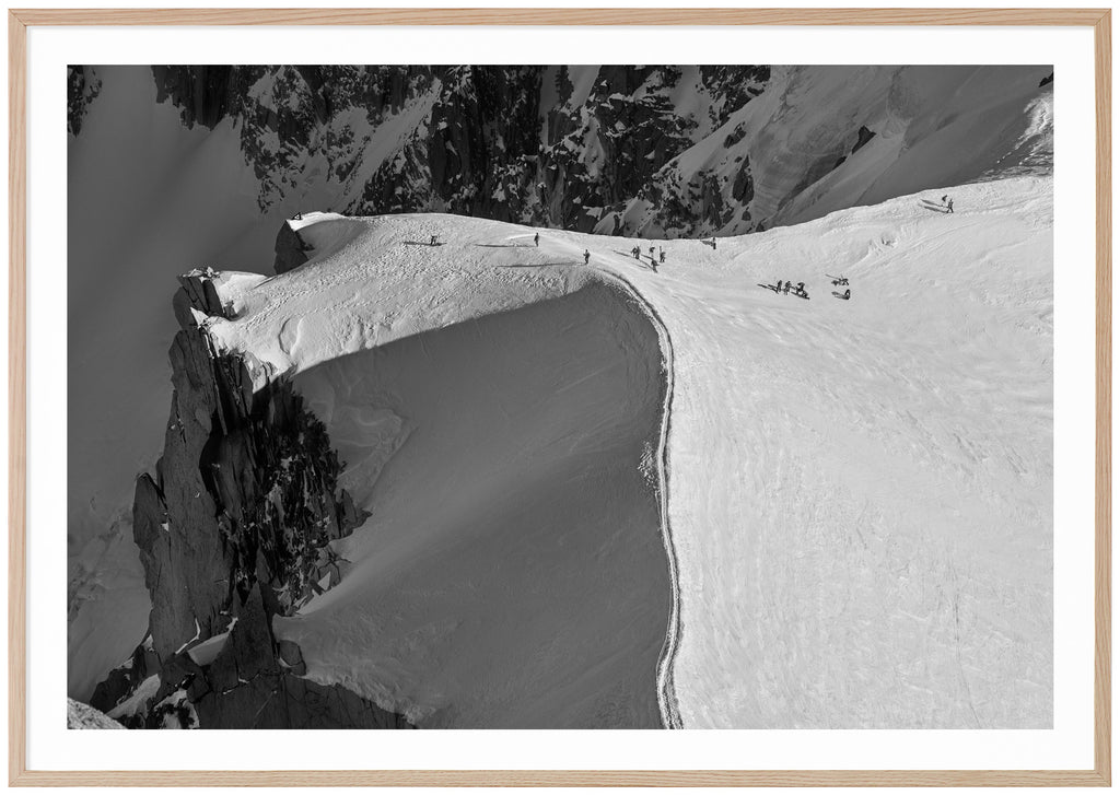 Bird's eye view of the snow-capped ridge at the Aiguille du Midi in Chamonix. Oak frame. 