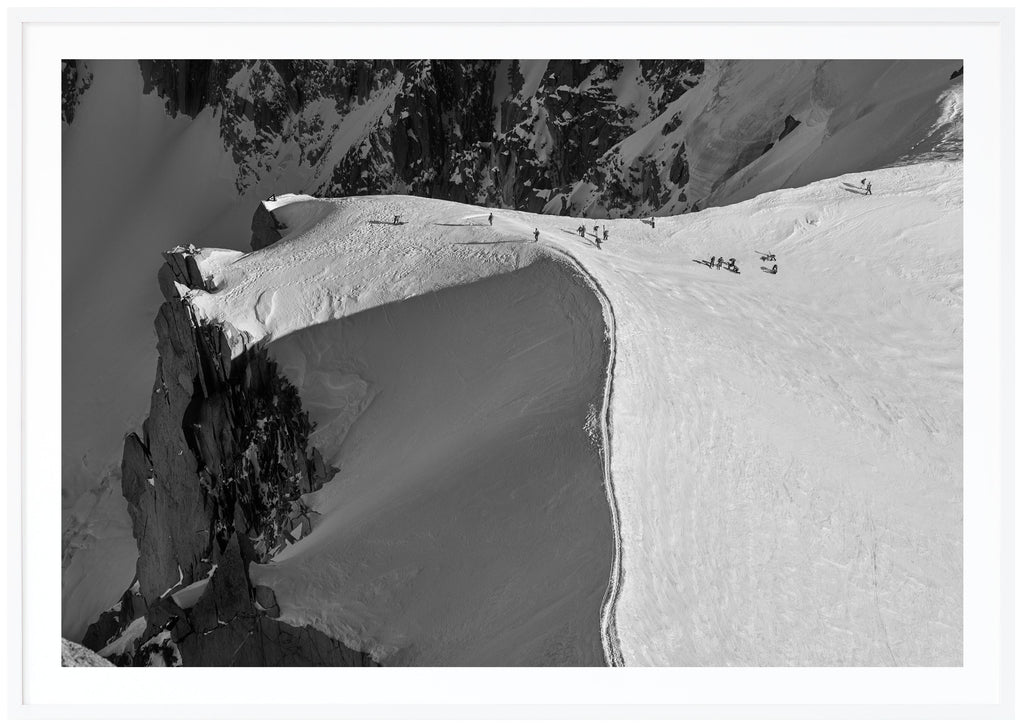 Bird's eye view of the snow-capped ridge at the Aiguille du Midi in Chamonix. White frame. 