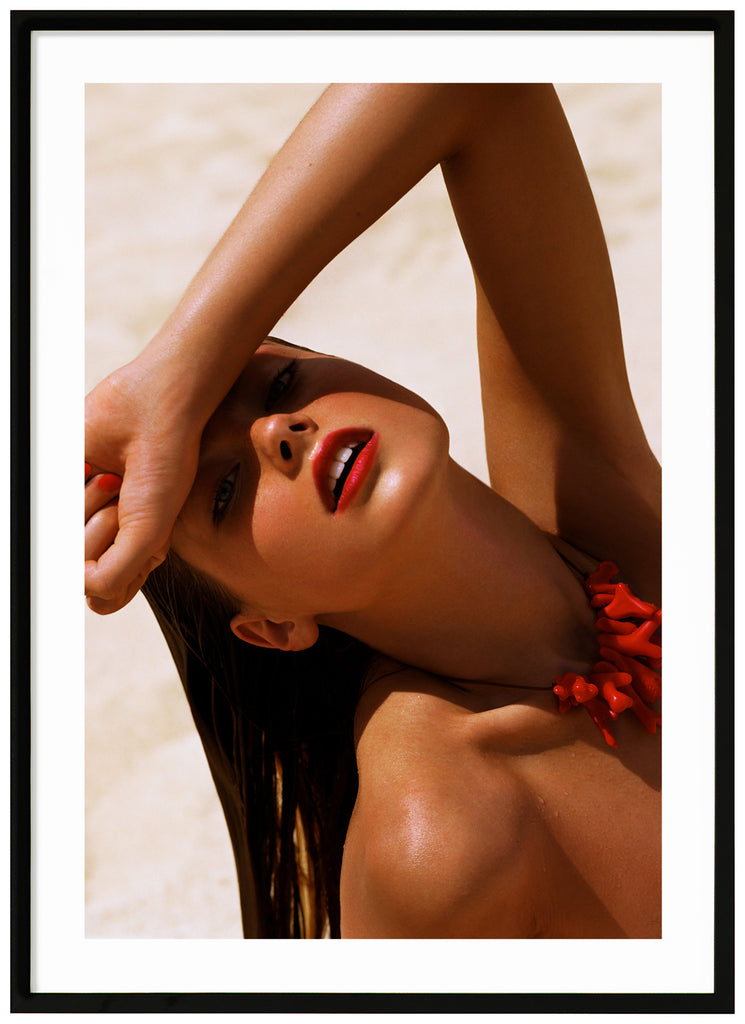 Photograph of a posed wet woman with red lips and top.  Black frame. 