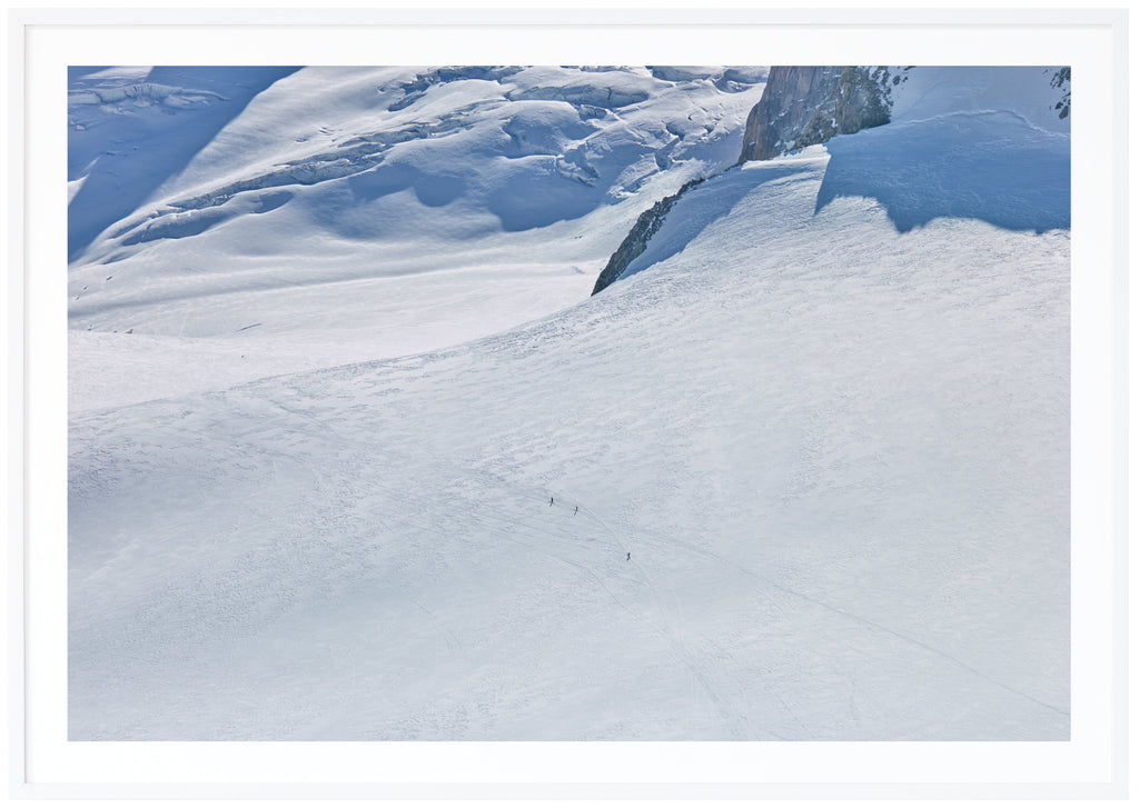 Color photography of a huge snow-covered surface, taken in the French Alps.  White frame. 