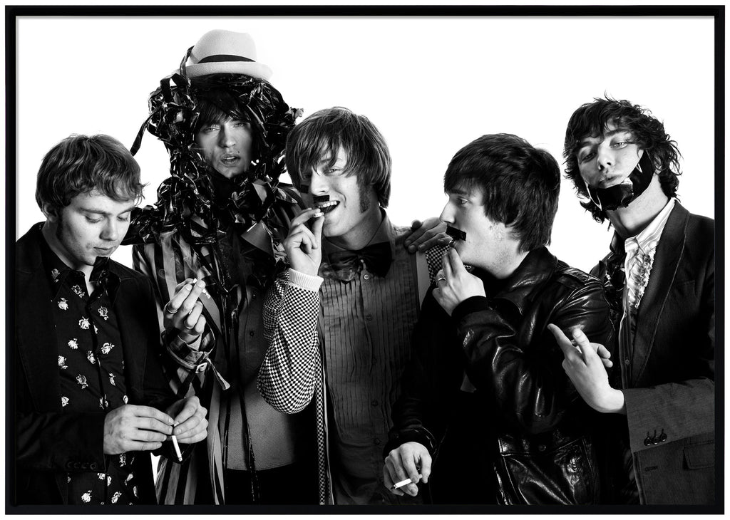 Black and white photograph by Patrik Sehlstedt of the rock group Mando Diao. Black frame. 