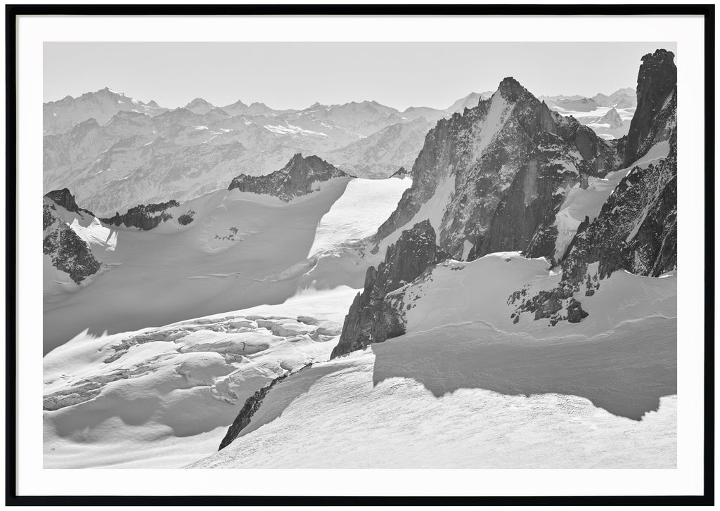 Magnificent view in the French Alps with snow-capped mountains and glaciers. Black frame. 
