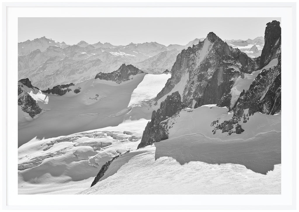 Magnificent view in the French Alps with snow-capped mountains and glaciers. White frame. 