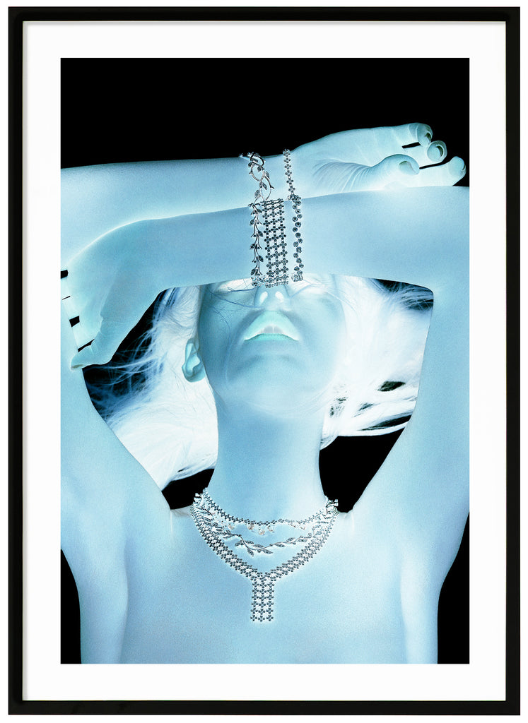 Poster of a woman in light blue glow. Black background. Black frame. 