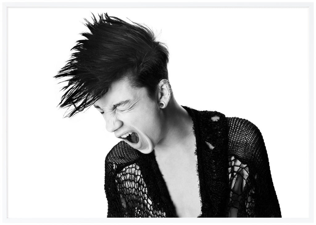 Black and white poster of guy screaming with hollow sweater. White frame.