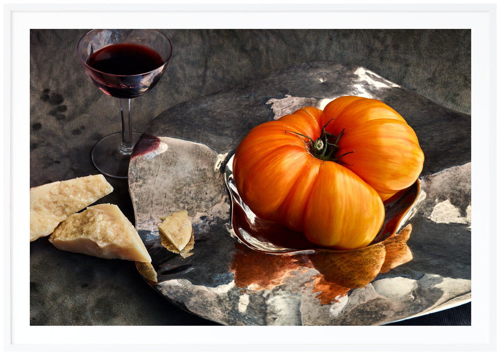 Still life in the color of a tomato, parmesan cheese and a glass of port wine. White frame. 