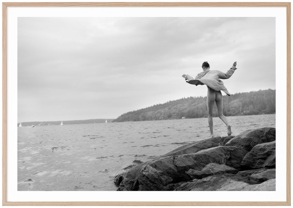 Black and white photograph of a woman on rocks in the archipelago.  Oak frame. 