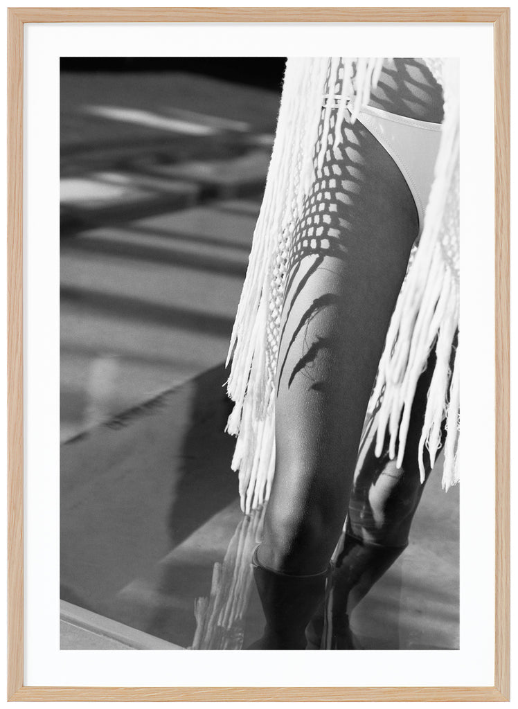 Black and white posters of a woman's legs with bikini. Oak frame.