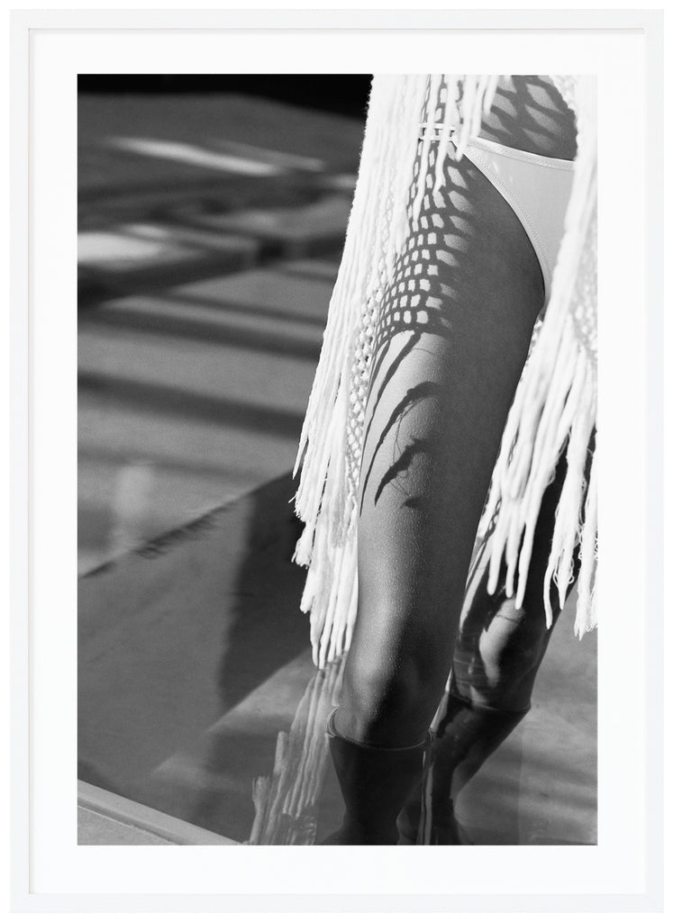 Black and white posters of a woman's legs with bikini. White frame.
