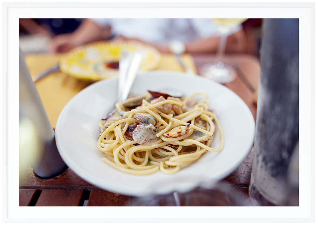 Color photography of one of the most classic dishes in Italy.  White frame.