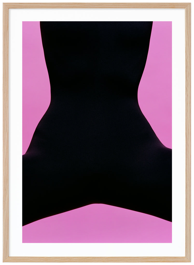 Poster with semi-abstract black motif with pink background.  Oak frame.