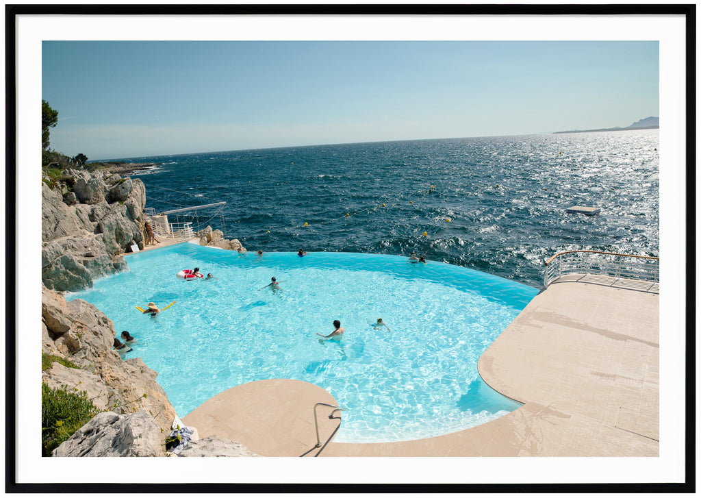 Color photograph of the pool at the mythical Eden Roc and Hotel du Cap on the French Riviera. Black frame. 