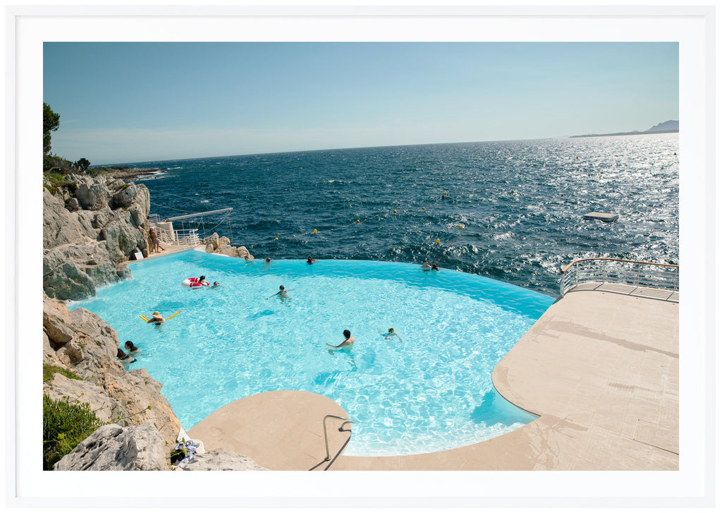 Color photograph of the pool at the mythical Eden Roc and Hotel du Cap on the French Riviera. White frame. 