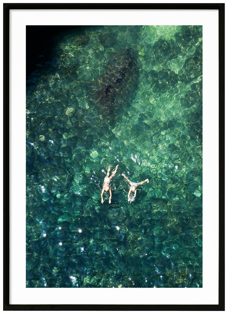 Records of two people swimming. Portrait format. Black frame. 