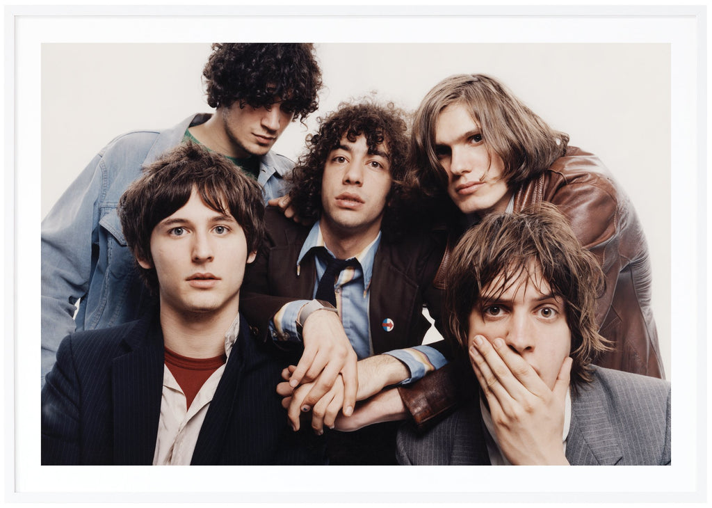 The American rock band The Strokes photographed in 2001 by John Scarisbrick in New York. White frame. 