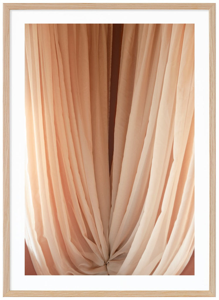 Color photography of curtains in beige tones. Oak frame. 