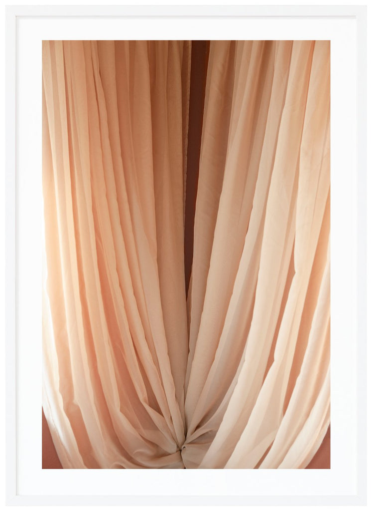 Color photography of curtains in beige tones. White frame. 